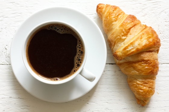 Croissant-and-coffee-on-rustic-white-wood-from-above.jpg